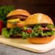 close-up-hamburgers-cutting-board_23-2148262994